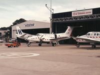 VH-AMS @ YSSY - Air Ambulance KingAir VH-AMS at the Sydney base, photograhed by Edwin van Opstal, displayed with permission. Scanned from a color print. - by red750
