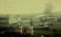N2885P - Bud Confer loading chemicals into N2885P in New Paltz NY in 1969 - by Merle Hahn