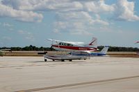 N30346 @ OBE - 1968 Cessna 177A N30346 in background at Okeechobee County Airport, Okeechobee, FL - by scotch-canadian