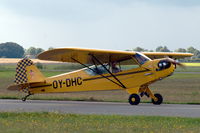 OY-DHC @ EKRK - Piper Cub taxying past at Roskilde airport, Denmark. - by Henk van Capelle