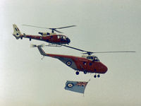 XR453 - Whirlwind HAR.10 of 2(A) Flying Training School flying the RAF ensign to open the flying display at the 1977 Royal Review at RAF Finningley accompanied by Gazelle HT.3 XW 898 - by Peter Nicholson