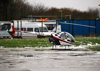 G-WINR @ EGTB - Robinson R22 Beta at Wycombe Air Park, shortly to depart to Denham. - by moxy