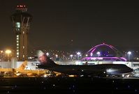 B-18207 @ KLAX - B-18207 with the tower and the Theme building at 1145PM - by Jonathan Ma