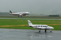 ZK-KVW @ NZDN - VH-VGV in the back on this gloomy morning - by Micha Lueck