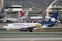 XA-GMV @ LAX - Taxying off Runway 25L at LAX wearing logos - by Duncan Kirk