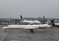 N13997 @ KORD - EMB-145LR - by Mark Pasqualino