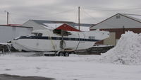 N611SS @ KANE - Parked behind a hangar @ KANE