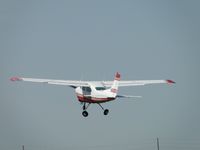 N68SU @ CCB - Landing gear being retracted - by Helicopterfriend