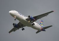 N604NK @ MCO - Spirit A320 with storm approaching