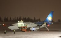 C-GDPA @ CYXY - Getting ready to load sled dog teams and other Arctic Winter Games freight on a snowy night in Whitehorse. - by Murray Lundberg