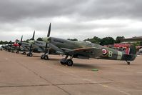G-ASJV @ EGSU - Spitfire lineup - by glider
