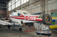 D-EHNW @ LHBS - Was involved in a landing accident on July the 11th 2011. The remains of the aircraft are now stored in the back of the hangar.