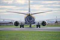 EI-DHS @ EGGP - Exiting taxiway A1 and joining runway 27 in readiness for take-off. - by Mark J Kopczewski