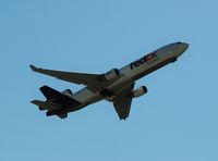 N576FE @ KMEM - Taking off from runway 36L - by Troy Raiteri