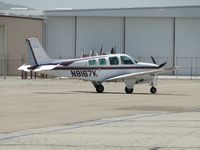 N8167K @ CNO - Taxiing towards the fuel pump area, passing Yank's backyard - by Helicopterfriend