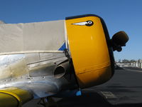 N4995C @ SZP - 1949 North American T-6G TEXAN 'Thirsty Girl', (factory remanufacture), P&W R-1340 Wasp 600 Hp, added flying 8-ball cowl logo - by Doug Robertson