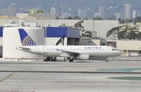 N469UA @ KLAX - Taxiing to gate at LAX - by Todd Royer