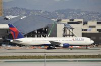 N121DE @ KLAX - Taxiing to gate at LAX - by Todd Royer