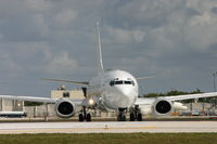 N741AS @ KMIA - Nice all-white ex-Alaska Airl B737-400
Turning onto rwy 12 at MIA - by Rembrandt Staller