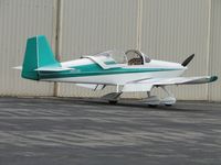 N670SB @ CNO - Parked near a hanger - by Helicopterfriend