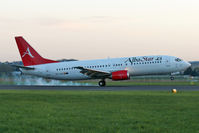 EC-LAV @ LOWL - AlbaStar Boeing B737-408 in the early morning morning on  Linz Airport (LOWL/LNZ) - by Janos Palvoelgyi