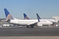 N14228 @ KSFO - United Airlines Boeing 737-824, UAL1168 getting a push from gate 89 KSFO for a trip to KIAH. - by Mark Kalfas