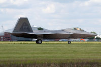 08-4166 @ LFI - 2010 Block 35 F-22A Raptor 08-4166 with the 94th FS Spads taxiing to the ramp after landing on RWY 26. - by Dean Heald