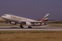 A6-EKY @ LMML - A330 A6-EKY Emirates Airlines during take-off from RW31 - by raymond
