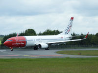 LN-NOL @ EDI - Specially marked B737-800 from Norwegian air shuttle lands on runway 24 - by Mike stanners