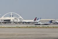 N234SW @ KLAX - Almost looks like a low rider. Taxiing in between the 25s - by Nick Taylor