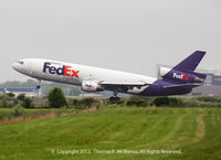 N571FE @ KPHL - FedEX 445 Heavy rotating on 27L departing a very overcast PHL. - by Thomas P. McManus