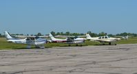 N6183T @ LPR - N1710G, N6183T and an unidentified aircraft are seen on the tarmac at Lorain County Regional Airport. - by aeroplanepics0112