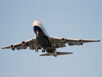 G-BNLI @ CYVR - Speedbird 747 passes the River Rock Hotel - by Jonathan Ma