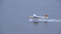 C-FIUZ @ CYHC - Landing @ Vancouver Harbor - by Murat Tanyel