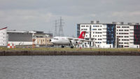 HB-IYZ @ EGLC - HB-IYZ arriving at London City Airport. - by Alana Cowell