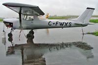 C-FWXS @ CYHU - Taken under very wet conditions. - by Ray Barber