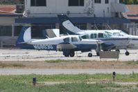 N6803U @ KFUL - Mooney parked by the tower