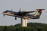 N327EN @ ORF - US Airways Express (Piedmont Airlines) N327EN (FLT PDT4108) climbing out from RWY 5 en route to Philadelphia Int'l (KPHL). - by Dean Heald