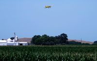 N4537X - Flying over central Illinois, just finished a spraying pass. - by Gene Rampale