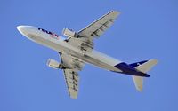 N668FE @ KLAX - Departing LAX on 25L - by Todd Royer