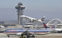 N559AS @ KLAX - Departing LAX on 25R - by Todd Royer