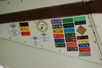G-BIAP @ EICL - Badges of honour on the door of this PA-16 - by Noel Kearney