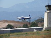 N409PC @ POC - Climbing out passing the tower, retracting landing gear - by Helicopterfriend