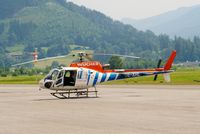 OE-XHL @ LOWZ - The Eurocopter of Wucher has just arrived after a beautiful sightseeing flight overhead the Alps. The doors are still open, because of the high outside temperature of 30 degrees centigrade. - by Jorrit de Bruin