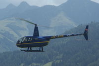 OE-XHK @ LOWZ - The four persons Robinson helicopter is landing direct on the Helicopter apron at Zell am See. - by Jorrit de Bruin