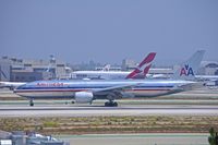 N798AN @ KLAX - American Airlines Triple Seven exiting Rwy 25L onto high speed taxiway Hotel Niner - by speedbrds