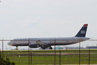 N555AY @ KORD - USAirways Airbus A321, departing RWY 22L KORD enroute to KCLT. - by Mark Kalfas