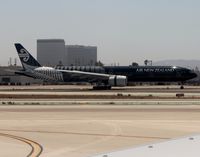 ZK-OKQ @ KLAX - Air NZ's All Blacks 777 arrives on 25L - by Jonathan Ma