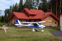 SE-VAX @ ESVS - A CT2K parked on the lawn in front of a house at Siljansnäs AirPark, Dalarna, Sweden. On the right is the taxyway to the airstrip. - by Henk van Capelle