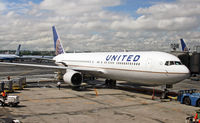N667UA @ KEWR - A newly repainted UA 767-322/ER awaits its next journey on a stormy day at Newark. - by Daniel L. Berek